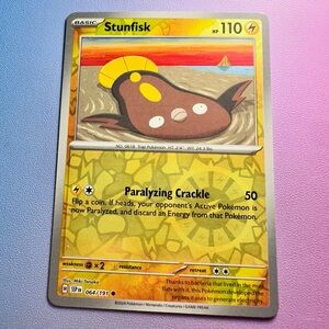 stunfisk [reverse holo] - 064/191 (common) — pokemon: surging sparks